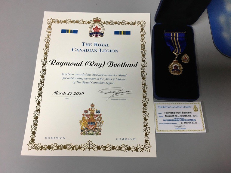Ray’s citation and medal