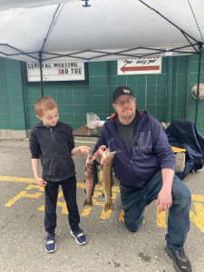 Father Rich and son Alden show off their prize catch.